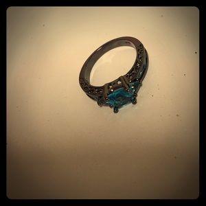 Black ring with teal stone